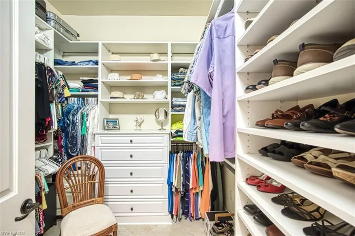 Spacious closet featuring tile patterned flooring
