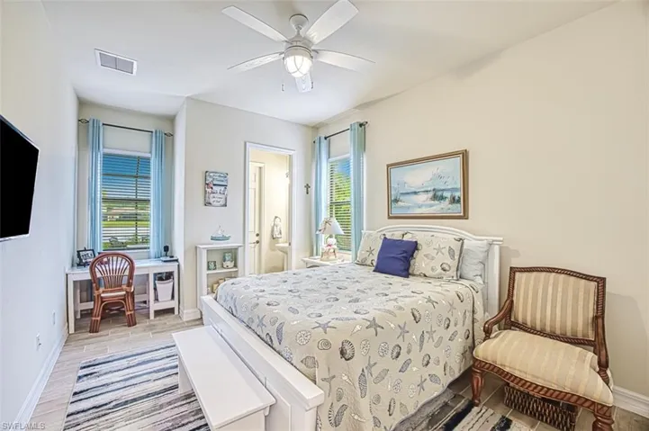 Guest Bedroom with multiple windows & bath