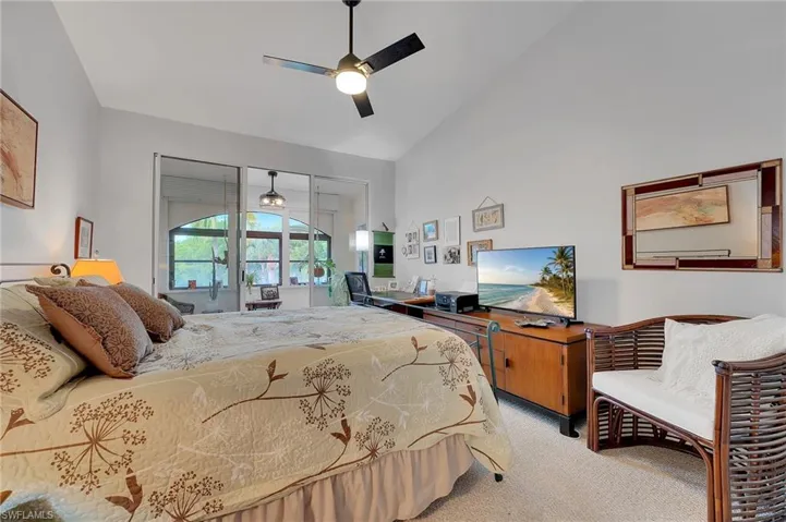 On the second level, one of two guest suites features a beautifully appointed sitting lanai, perfectly positioned to overlook the tranquil lake, offering a serene and private retreat for guests.