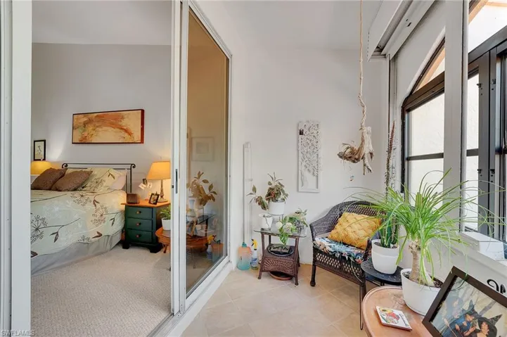 The lanai, located off the second bedroom suite, is fully enclosed, creating a private and tranquil space to enjoy year-round comfort and serene surroundings.