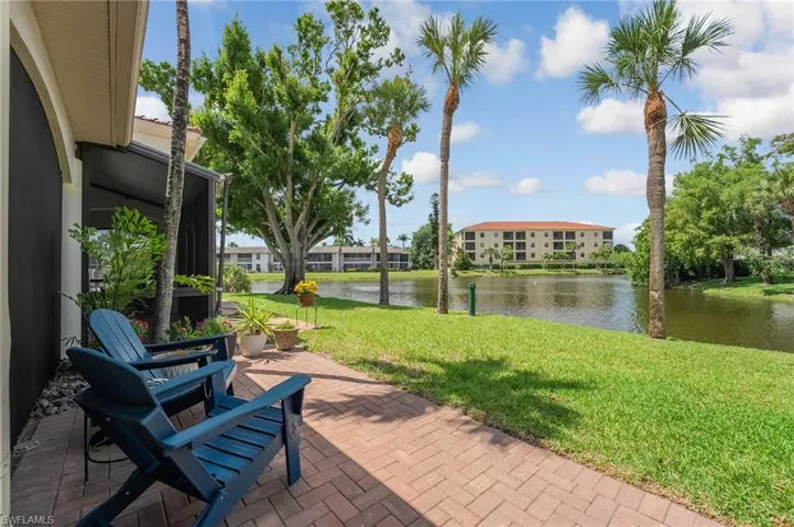 An inviting outdoor seating area captures even more expansive lake views, set upon a beautifully pavered deck and enhanced with a guttered system for added comfort and functionality.