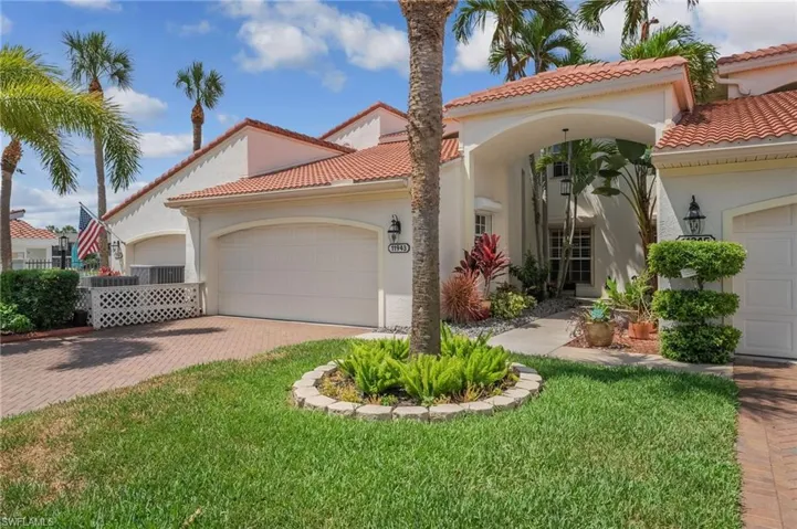 An inviting entrance welcomes you home, complemented by a spacious two-car garage, a beautifully pavered driveway, and lush, manicured landscaping that enhances the property’s refined curb appeal.
