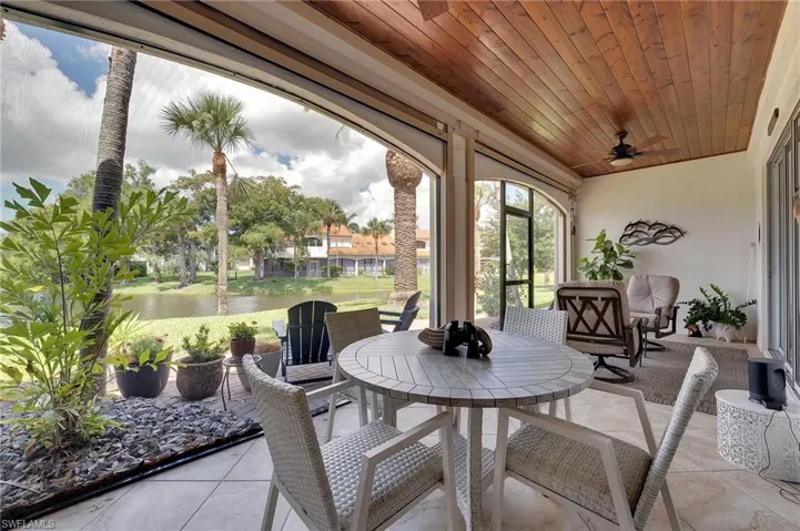 Enjoy serene lake views from your screened in lanai, where a tongue-and-groove ceiling adds warmth and character, complemented by newly installed hurricane screens for enhanced comfort and peace of mind.