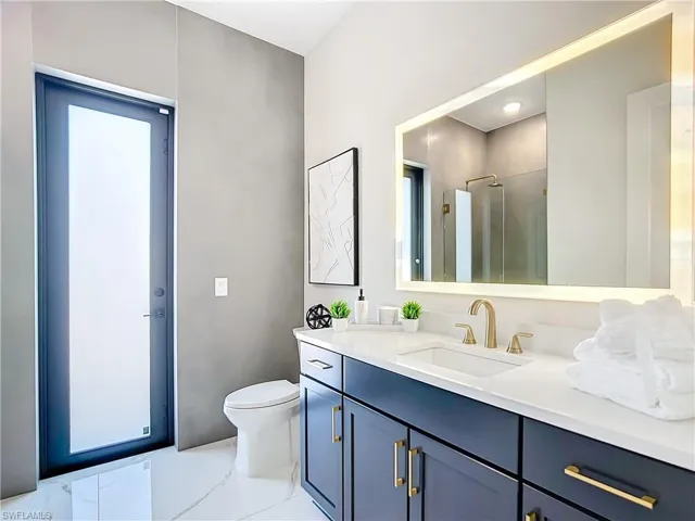 Bathroom featuring vanity and toilet