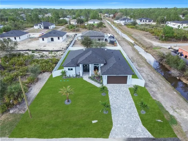 Aerial view of residential area with a nearby body of water
