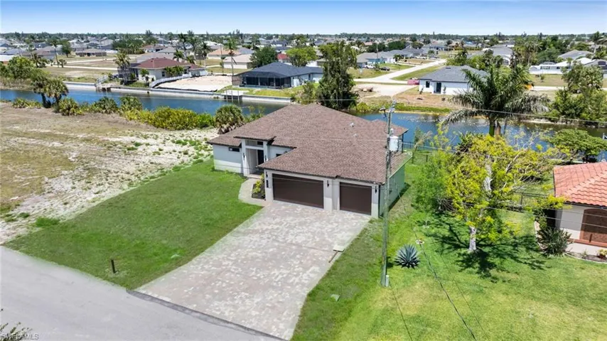 Aerial perspective of suburban area with a large body of water