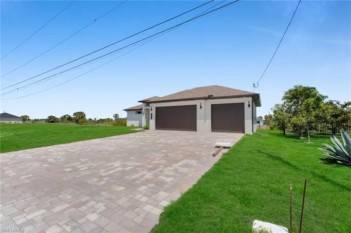 Garage with decorative driveway