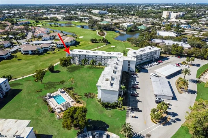 Aerial overview of property's location with a golf club and a large body of water