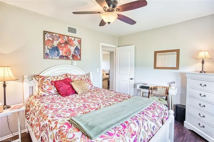 Quest Bedroom featuring dark wood-type flooring and a ceiling fan