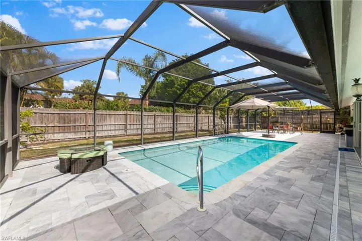 View of pool featuring a lanai and a patio area