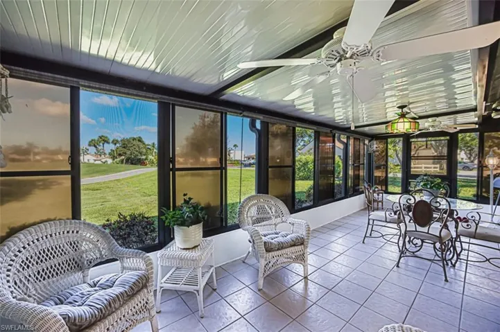 Sunroom / solarium with a ceiling fan and outdoor lounge area