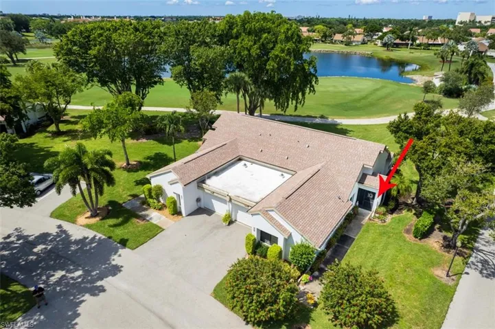 View from above of property featuring a large body of water and a golf club