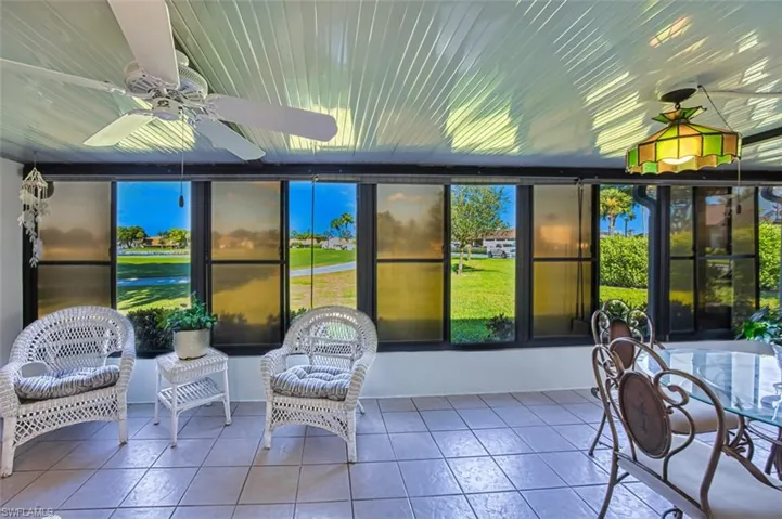 Sunroom / solarium with tile patterned floors