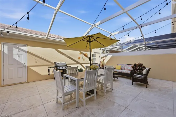 View of fully screened-in lanai and access to the Garage