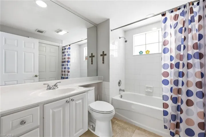 First Floor Bathroom featuring shower / bath combo and vanity