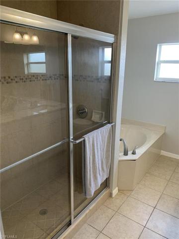Separate shower and soaking tub in the owners suite.