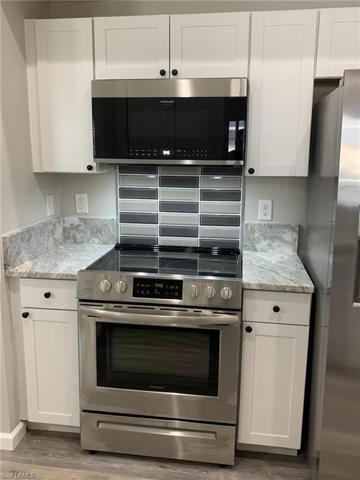 Custom backsplash and gorgeous tropical brown granite (much lighter than the name makes it sound)