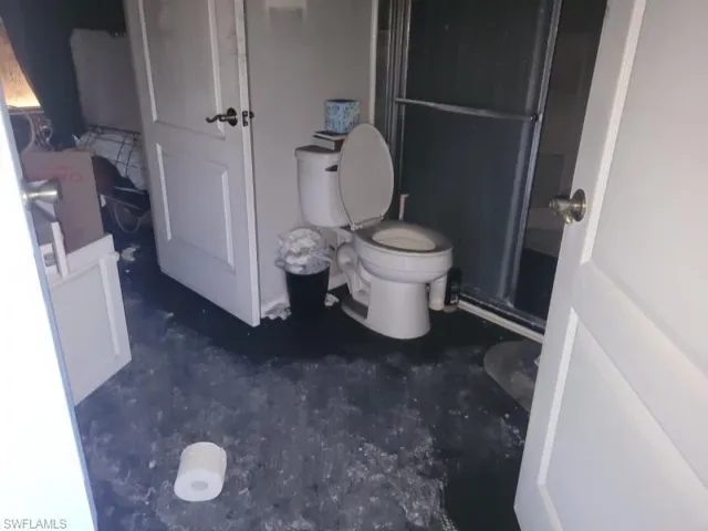 Bathroom with an enclosed shower and toilet