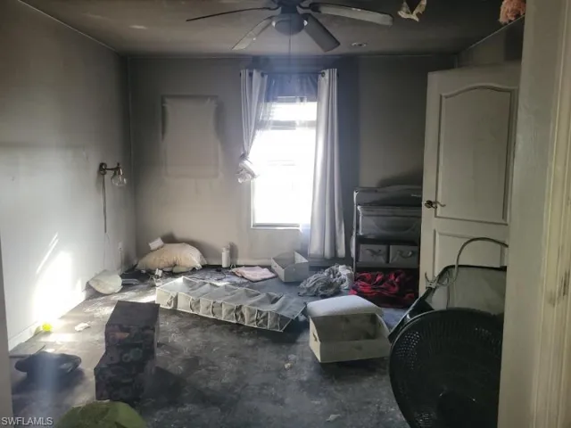 Bedroom with concrete floors and ceiling fan