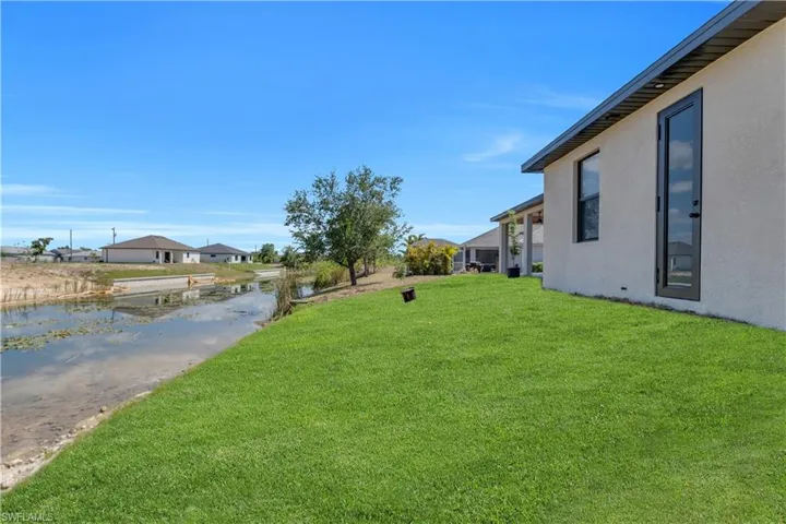 View of grassy yard featuring a water view