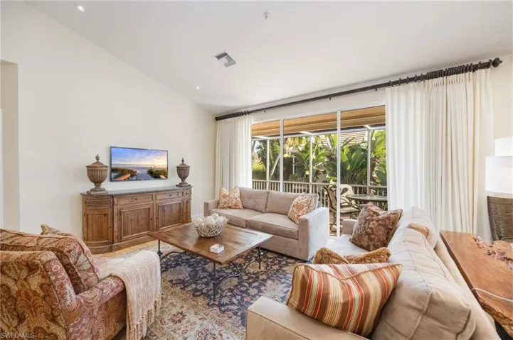 Living room featuring vaulted ceiling