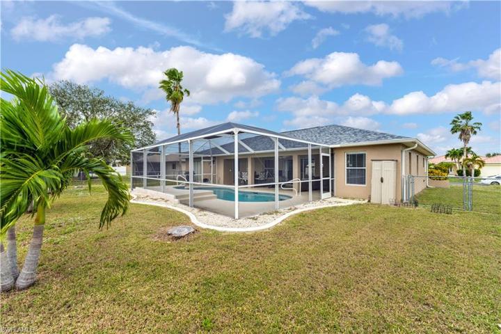 Fenced yard and plenty of space behind the pool enclosure.