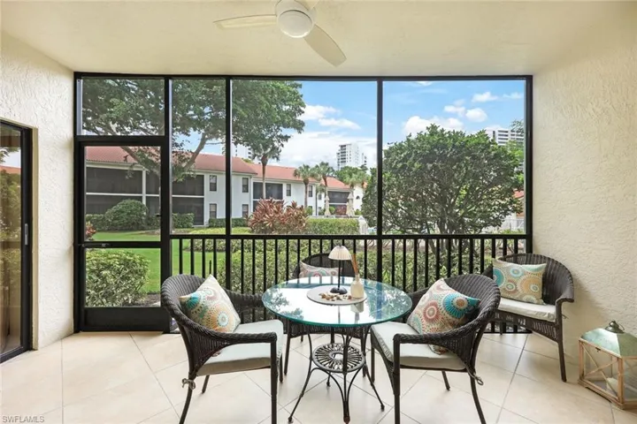 Sunroom / solarium featuring ceiling fan