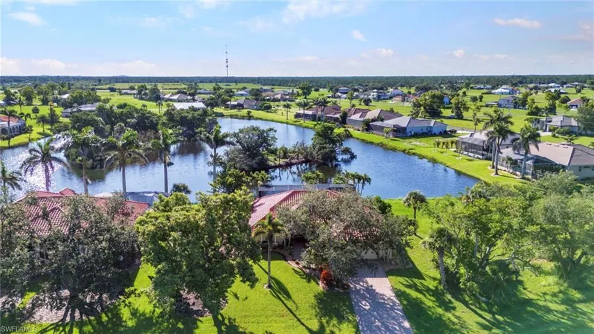 Aerial view of residential area featuring a large body of water