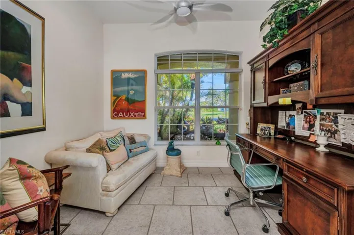 Home office featuring ceiling fan and baseboards
