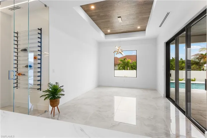 A HIGHLIGHT of the home is also the SPECTACULAR 55-bottle WINE RACK nestled within a DEDICATED WINE CLOSET, adding a TOUCH of LUXURY to your ENTERTAINING ENDEAVORS.
