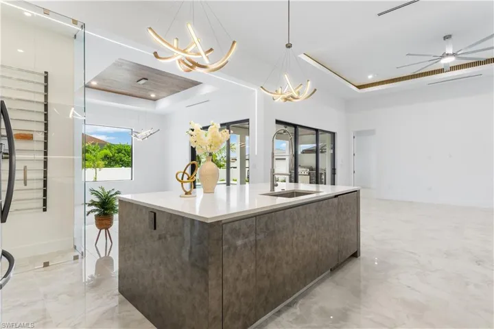 EXPANSIVE KITCHEN ISLAND offers VERSATILE SEATING OPTIONS for FORMAL DINNING or CASUAL MEALS