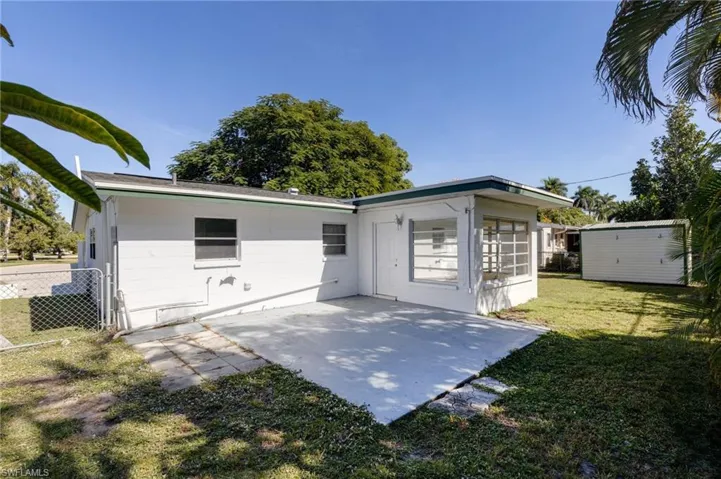 Rear view of house featuring a patio