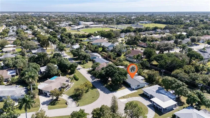 Aerial view of property's location featuring nearby suburban area