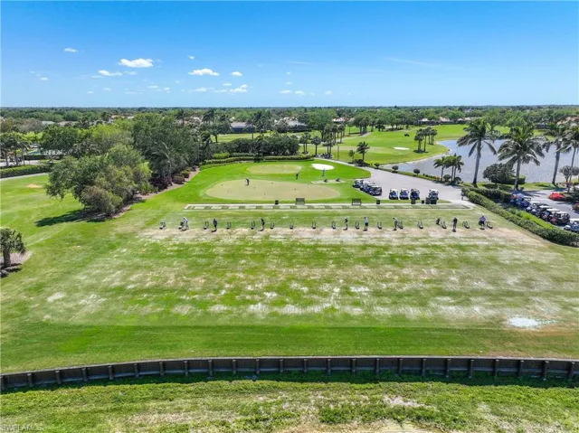 Drone / aerial view of a golf club and a nearby body of water