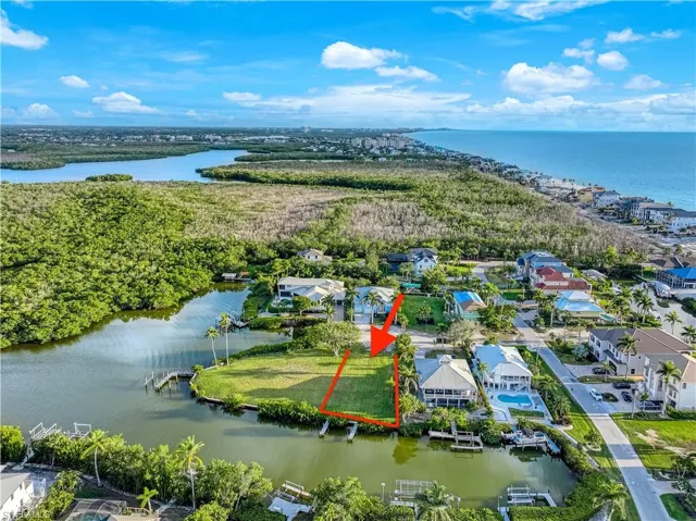 Aerial perspective of suburban area with a nearby body of water