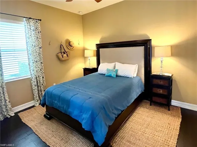 Bedroom with wood finished floors and a ceiling fan