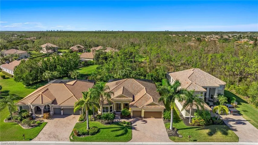 Aerial view of residential area with a heavily wooded area