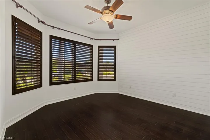 Spare room featuring wood finished floors and ceiling fan