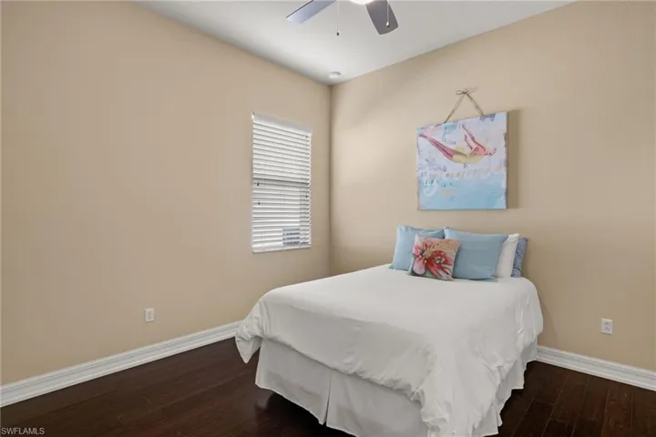 Bedroom featuring wood finished floors and ceiling fan