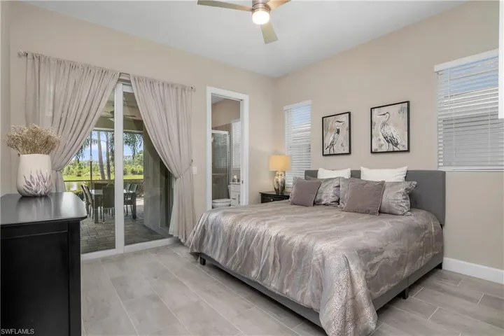 Guest bedroom with ensuite bathroom that doubles as pool bath and has private access to the outdoor lanai and pool/spa.