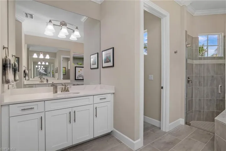 Two vanities--one on each side of the bathroom, give everyone their own private space.
