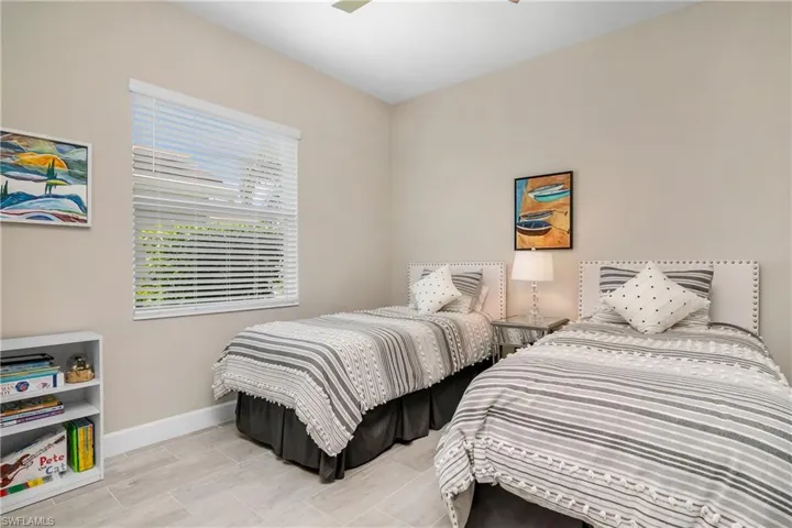 Spacious guest bedroom has plenty of room for twin beds or a king.