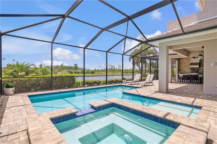 Heated pool and spa overlooking canal water views and protected preserve.