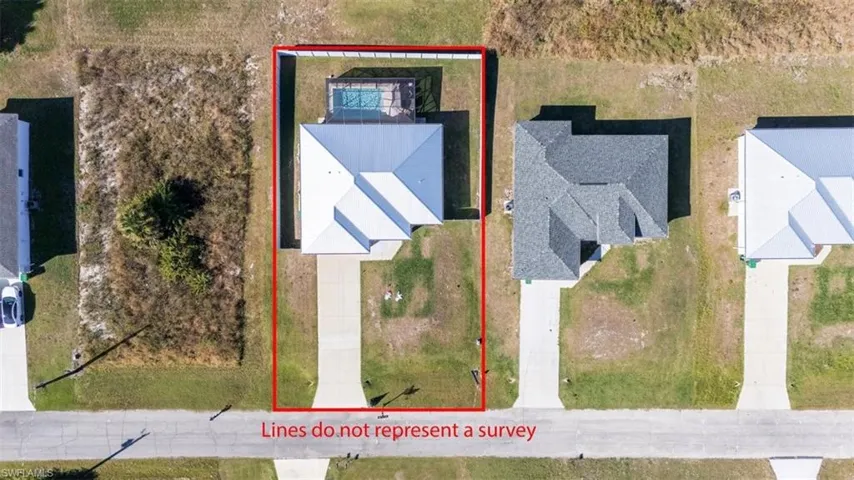 Aerial view of property and surrounding area featuring property parcel outlined