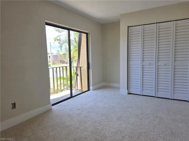 Room featuring light-toned carpeting and neutral wall tones