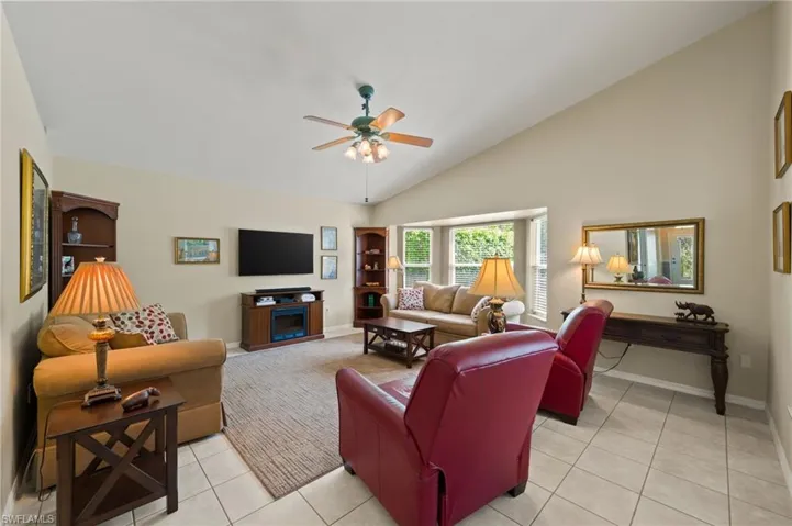 Family Room with Slider to Lanai, Vaulted Ceilings and Tile Floors