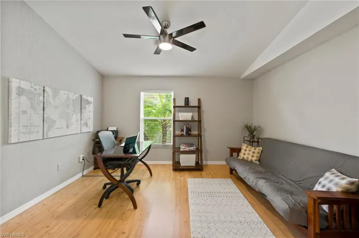 Home Office/Den with lofted ceiling, light hardwood / wood-style floors, and ceiling fan