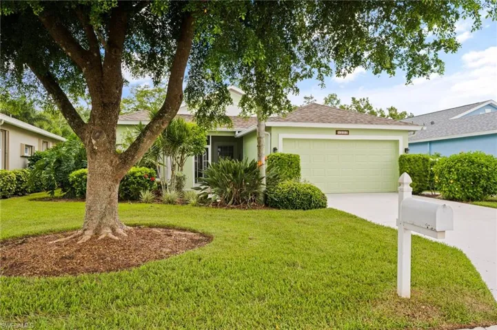 Front view of home with mature Tree