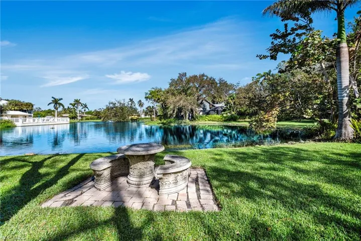 View of yard with a water view