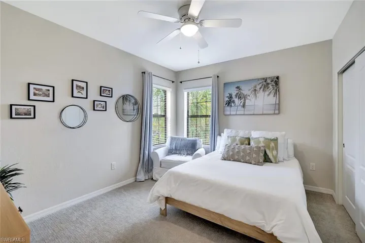 Guest Bedroom with plenty of natural light and ceiling fan.